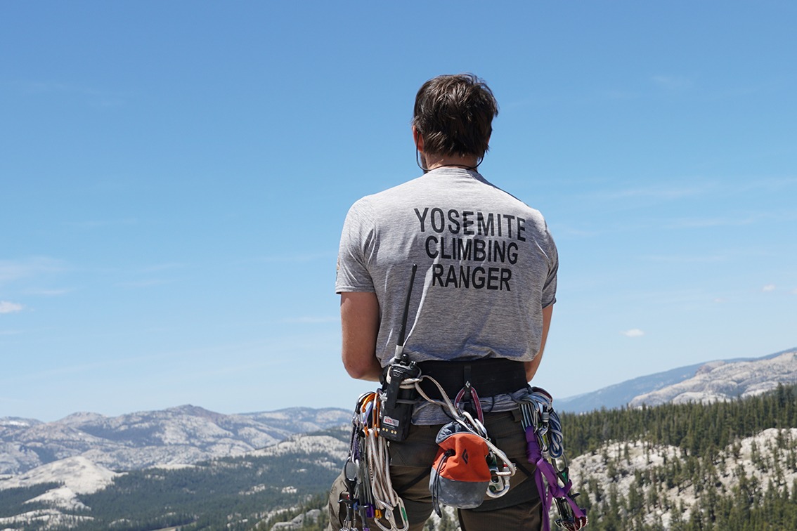 A Yosemite climbing ranger takes in the view from Lembert Dome, in Tuolumne Meadows. Photo: NPS/Jesse McGahey