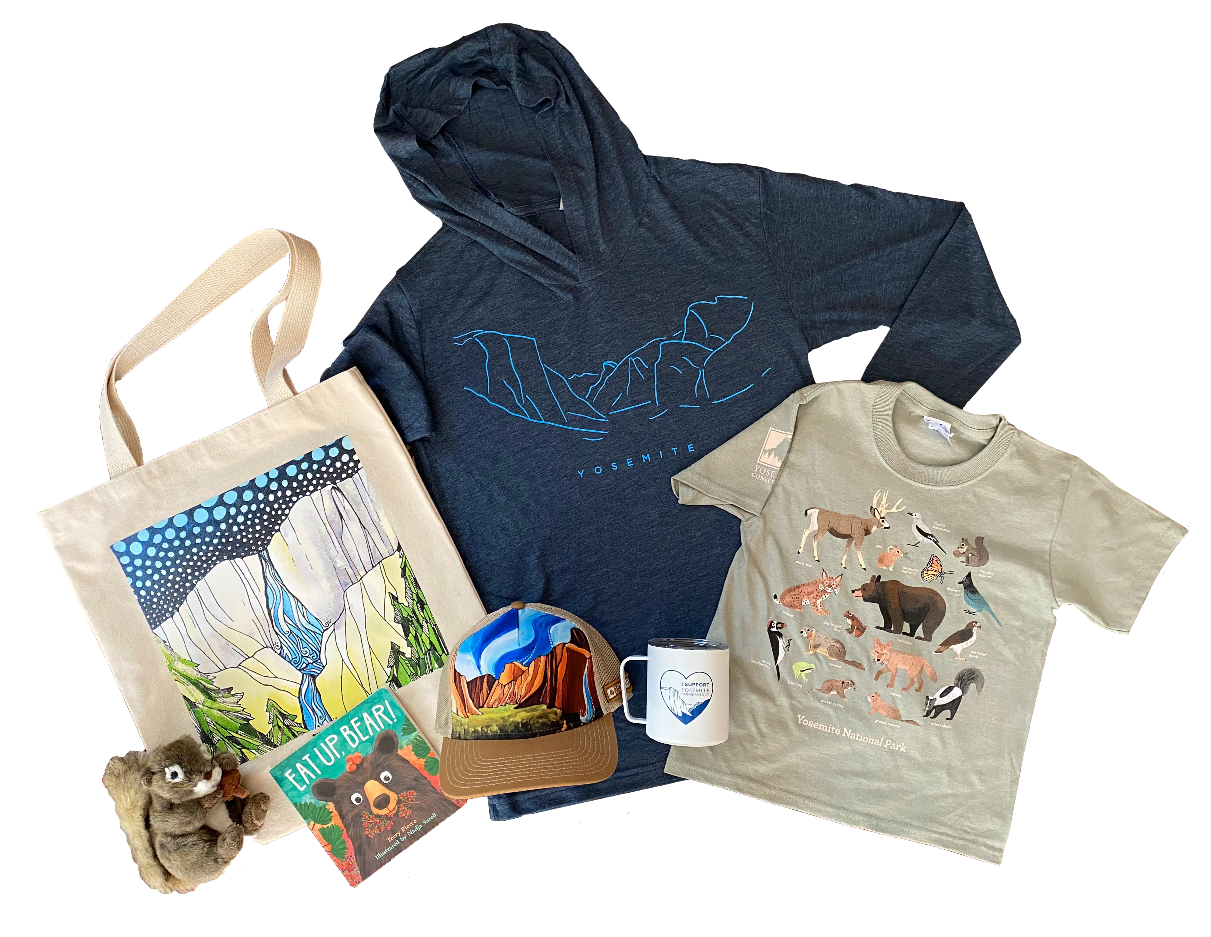 A collection of Yosemite-themed retail items arranged with a white background. Includes a hoodie, tote bag, tee shirt, mug, hat, book and stuffed animal.