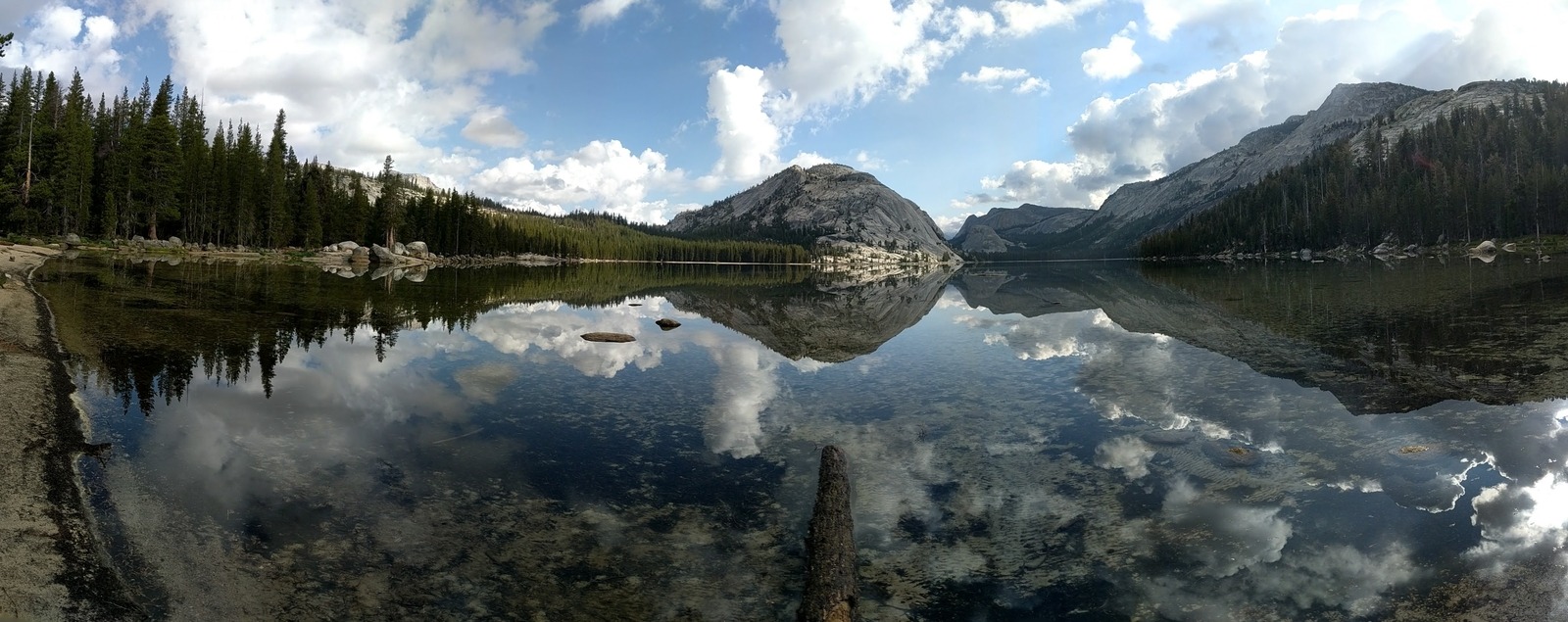 Mountains and trees reflecting in a lake