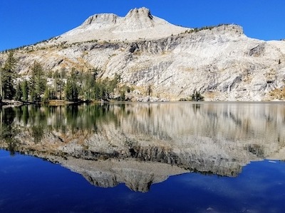 Alpine Lake with Mountain in background and reflection