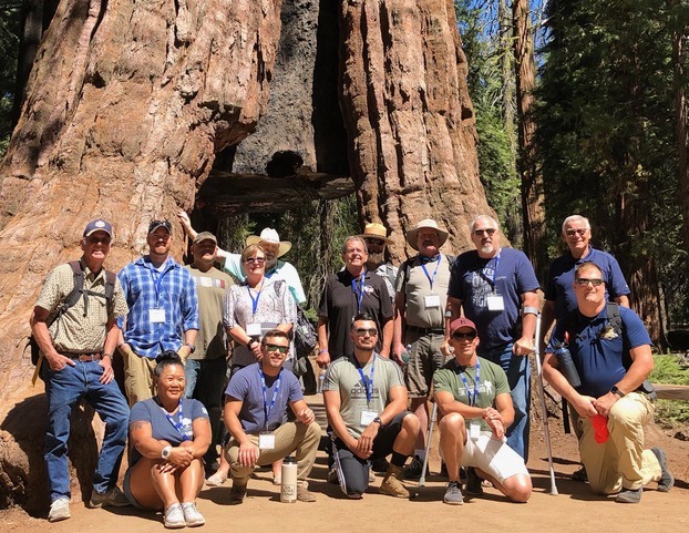 Attendees of the Yosemite Veterans Education and Leadership Seminar gather at Mariposa Grove to learn about careers in the Park Service. © Steve Shackelton