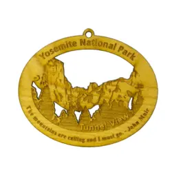 Wooden oval ornament that says Yosemite National Park, a quote from John Muir, and the outline of the view from Tunnel View.