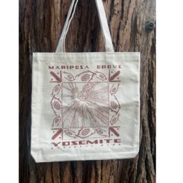 image of toge bag with brown text and design of mariposa grove trees, hanging on a tree
