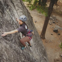 United in Yosemite climber scales the granite boulders in Yosemite Valley. Image by Miya Tsudome.