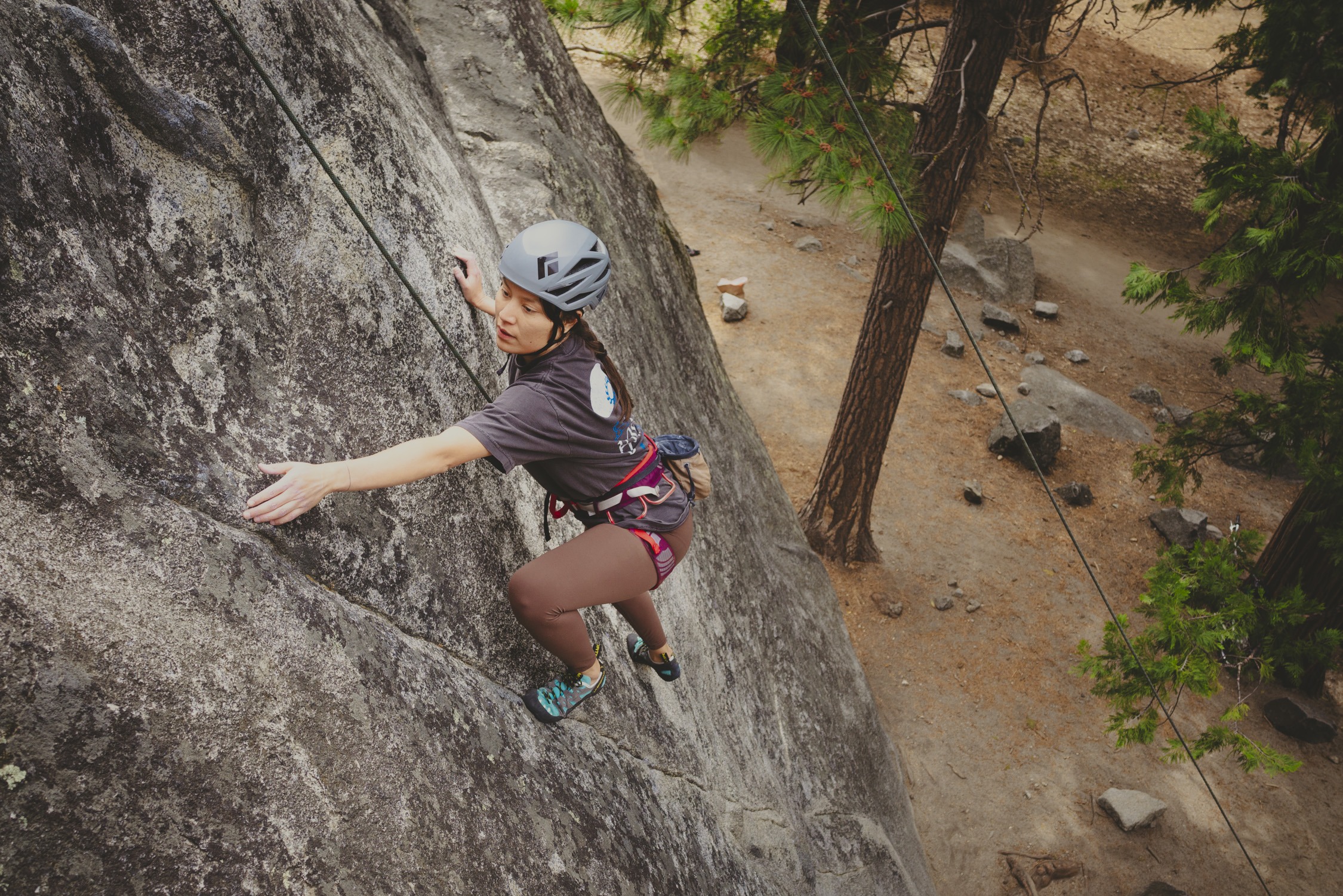 United in Yosemite climber scales the granite boulders in Yosemite Valley. Image by Miya Tsudome.