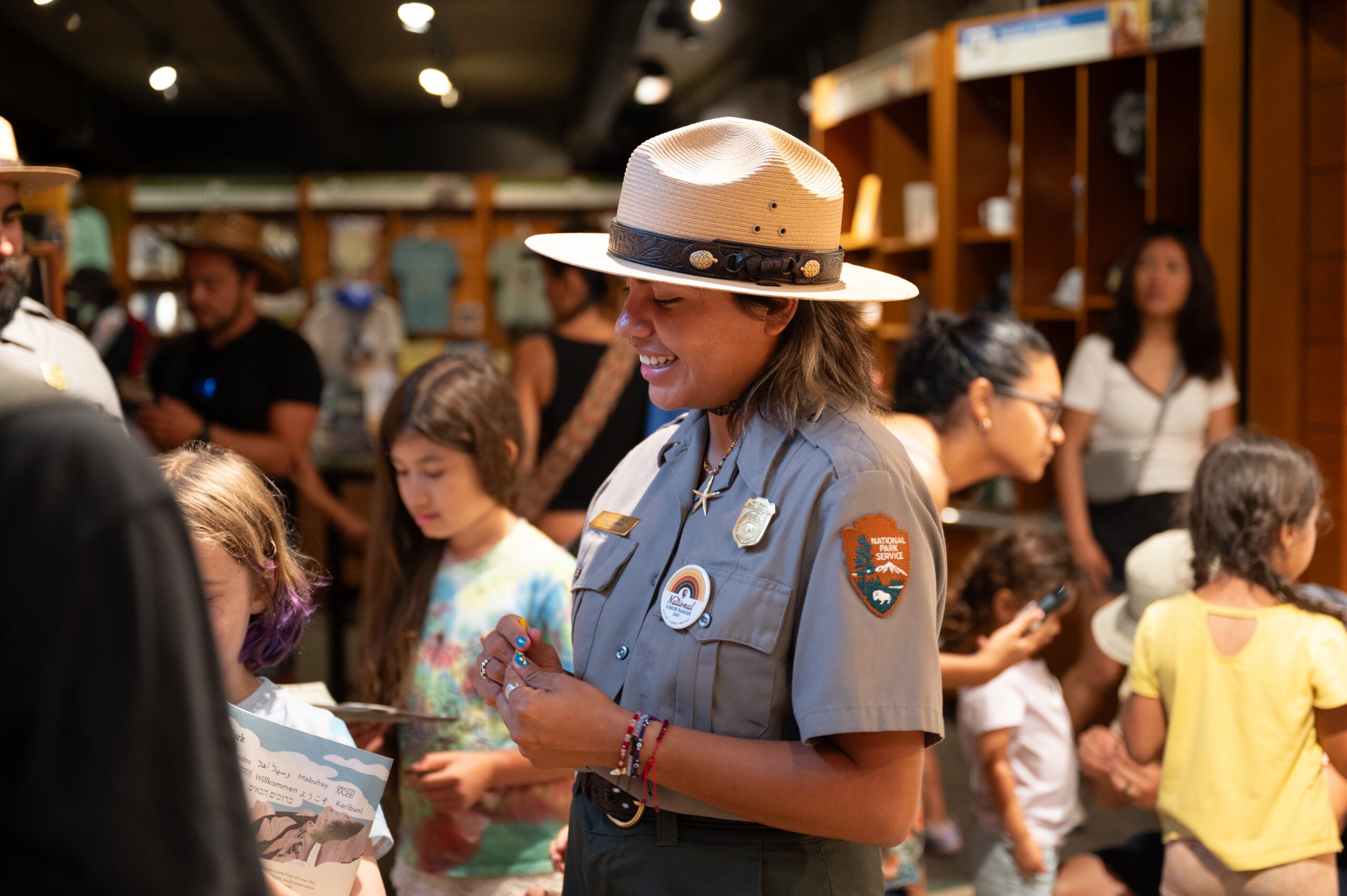 photo of a national park service ranger in Yosemite talking in a group of people.