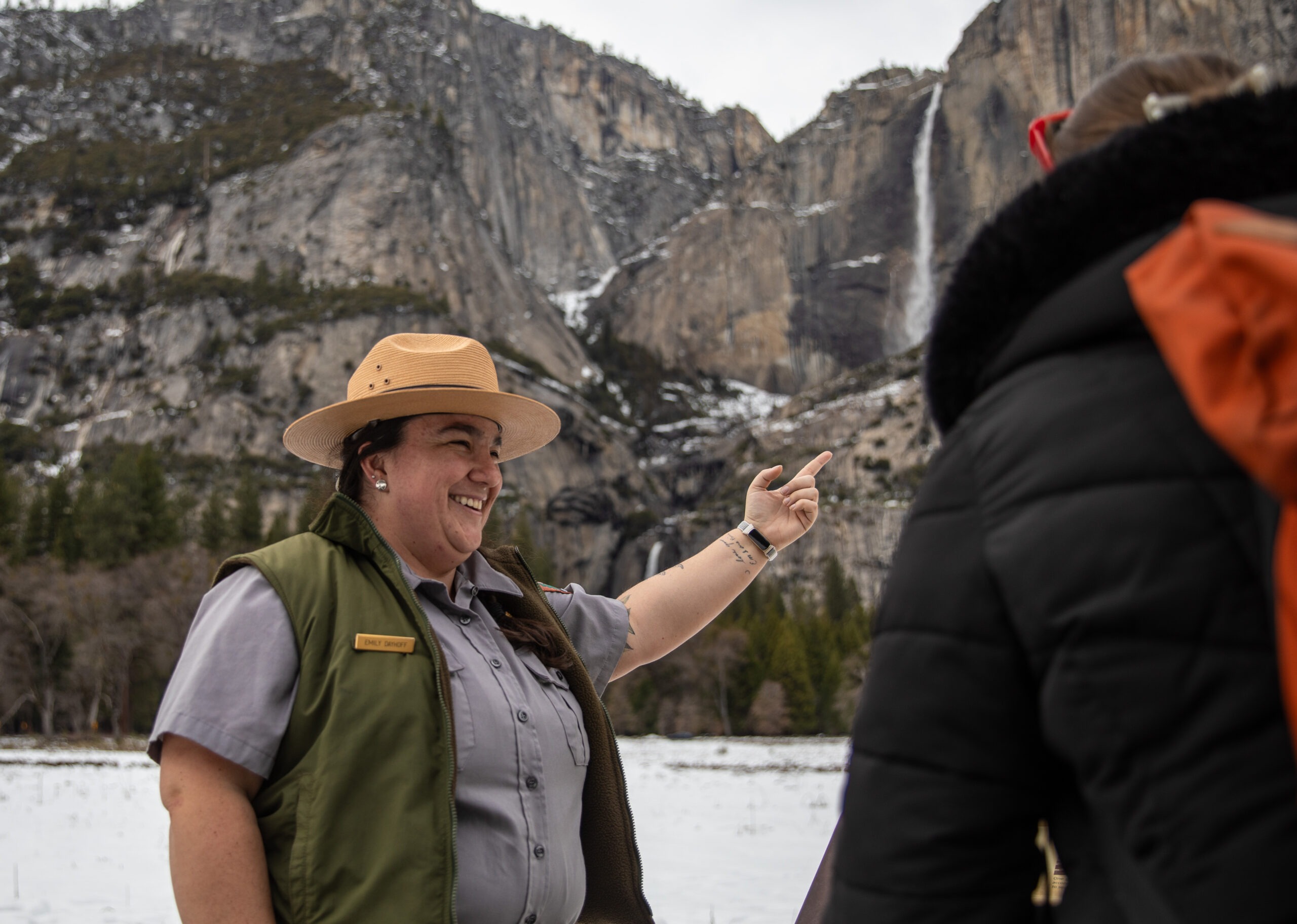 Cultural Demonstrator Emily Dayhoff points visitors to features in Yosemite Valley. We are still here.