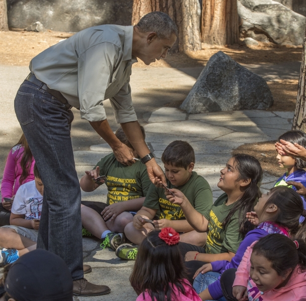 President Obama hands park passes to fourth graders during his June 2016 Yosemite visit. Photo: © Al Golub.