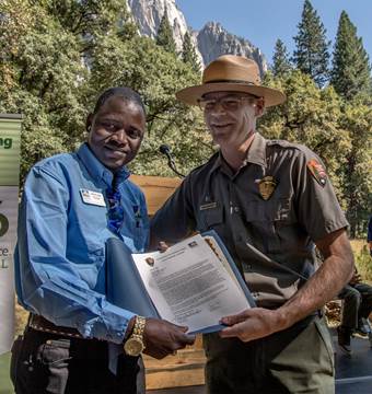 Olotumi Laizer accepts one of this year's two Yosemite Partnership Awards; the other went to NPS landscape architect Kimball Koch. Photo: Al Golub.