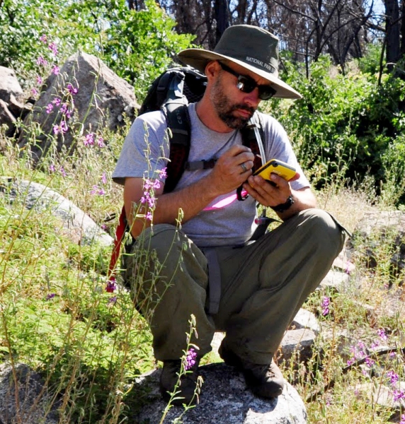 Mapping plants with a GPS device. Photo: NPS.