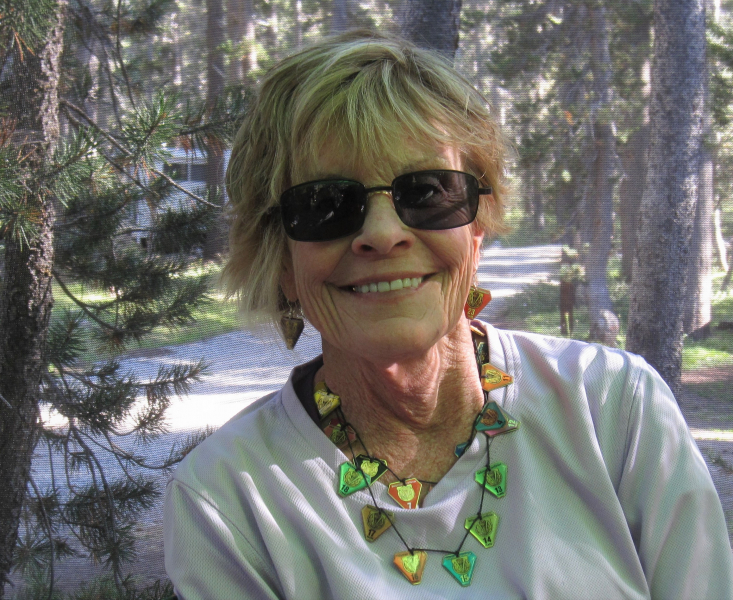 Judy Johnson, pictured here sporting a necklace of volunteer pins, has donated her time to Yosemite for more than two decades. (Photo courtesy of Judy Johnson)