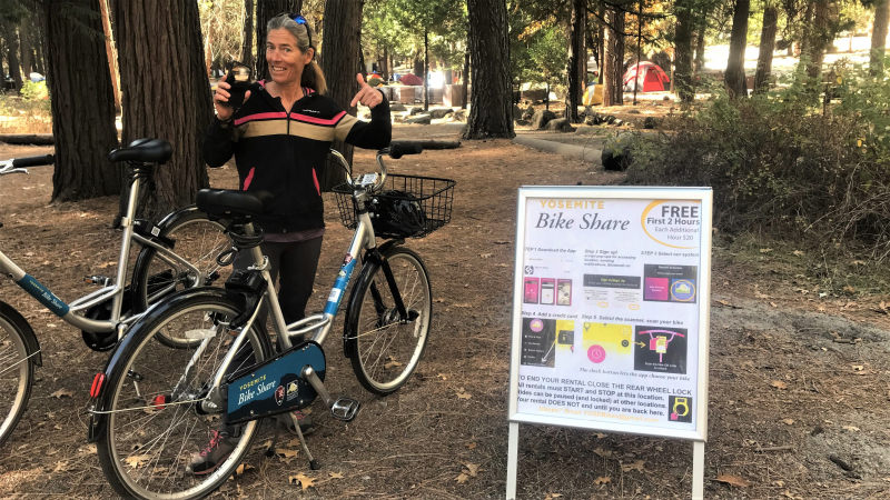 Climber Lynn Hill gets ready to take a spin on one of the dockless bicycles available through the new Yosemite Bike Share program. Photo: Ryan Kelly