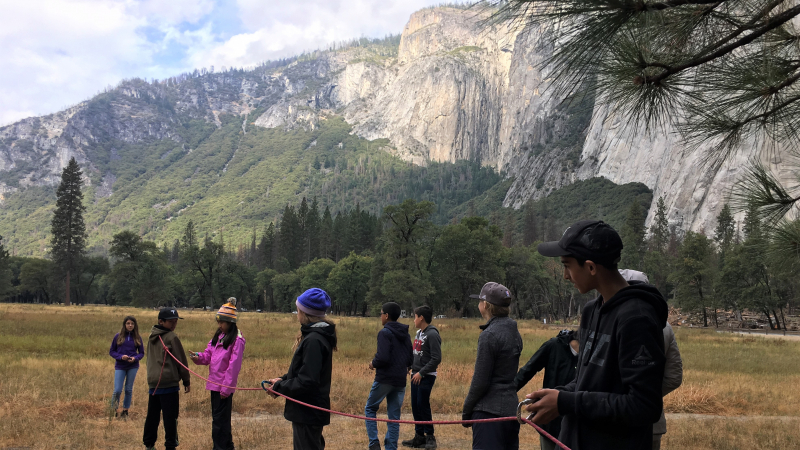 NatureBridge students enjoyed a hands-on lesson in the physics of climbing during a special session with Yosemite climbing rangers. Photo: Courtesy of NatureBridge
