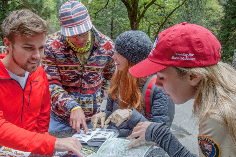 Volunteer Visitor Information Assistants help visitors learn about and navigate the park. Photo: Keith Walklet.