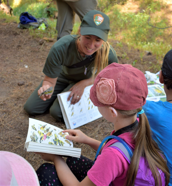 Biologist Sarah Stock teaches budding scientists about songbird research. Photo: © Yosemite Conservancy/Ryan Kelly