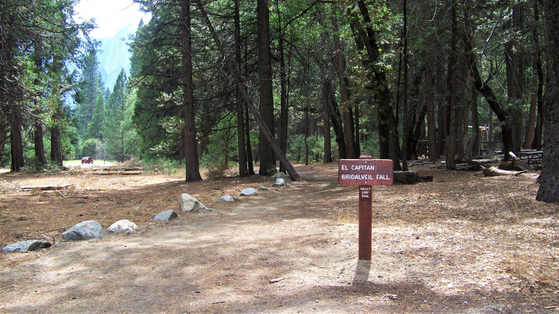 A sign on the Valley Loop Trail beckons hikers toward iconic Yosemite Valley features. Conservancy donors have supported numerous grants to improve sections of this loop, including through a multiyear campaign that resulted in the rehabilitation of 75 miles of trails throughout the park. Photo: NPS.