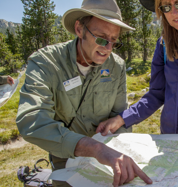 Dan Webster delivers a map-reading lesson near the shores of Elizabeth Lake during an August 2016 day hike in Yosemite's high country. Photo: Yosemite Conservancy/Keith Walklet