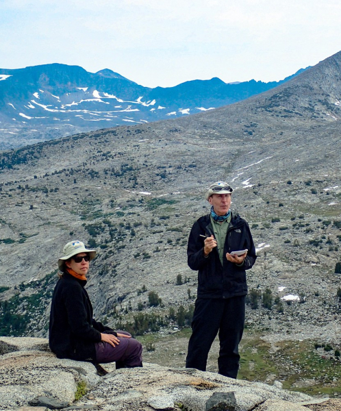 Naturalists Andrea Canapary and Pete Devine take in the landscape near Mount Lyell during a multiday backpacking adventure in eastern Yosemite. Photo: Roy Williams Photography