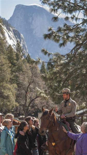 Yosemite Conservancy donors meet the park's mounted patrol team during a Spring Gathering event in the Valley. Photo: Yosemite Conservancy/Al Golub