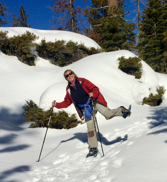 Conservancy team member Carolyn shows off her layering technique during a snowshoe hike to Dewey Point. Layers help you quickly adapt an outfit to your activity level and body temperature, and to weather shifts. Photo: Carolyn Botell