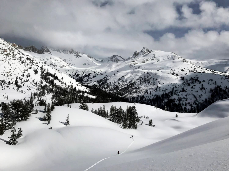 And on to the next site! The crew assessed conditions and decided it was safe to make the tough trek up and over Mule Pass. From the high point (elevation 10,489 feet), they took in the view of Sawtooth Ridge, Matterhorn Peak and the Finger Peaks before cruising down the fresh, untouched snow.