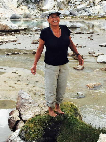 Margreet: barefoot, beaming and completely in her element in the Sierra Nevada. Photo courtesy of Margreet Fledderus.