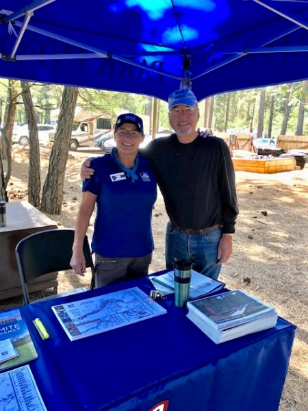 Margreet and fellow volunteers welcome people at the Conservancy's blue-hued information booths, where they help visitors figure out what to do and where to go in Yosemite.