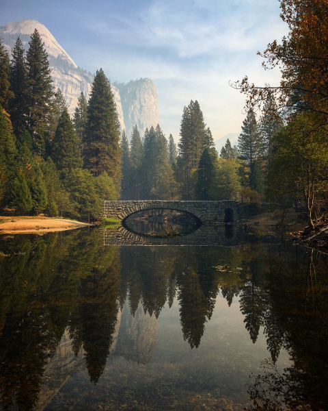 Autumn reflection of Stoneman Bridge over the Merced River. A raging river in the spring and yet a most peaceful and calm river in fall.