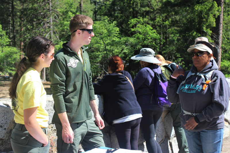 PSAR interns Katie and Clark talk to a Yosemite hiker. Photo: Courtesy of NPS