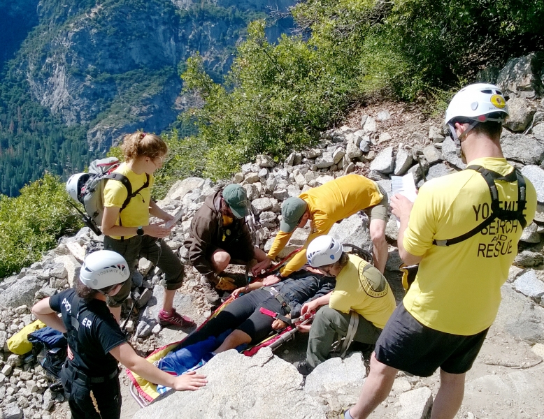 PSAR volunteers work with Yosemite's Search and Rescue team to help an injured hiker on the Four Mile Trail. Photo: NPS