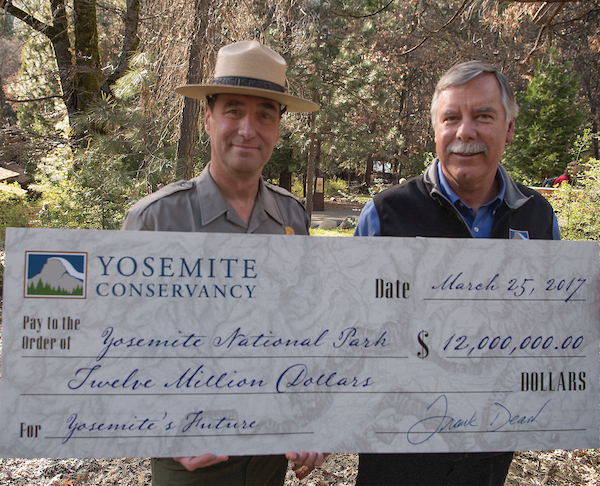 Conservancy President Frank Dean and Acting Superintendent Chip Jenkins with a ceremonial check for $12 million. Photo: Al Golub.